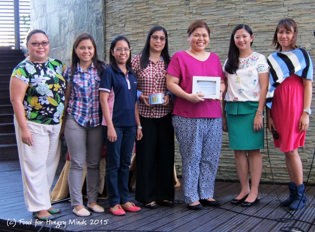 In the photo: Synchrony Financial Volunteers Lead, Christine Plata (2nd from the right) with Hungry Minds Teachers and Staff and two Synchrony Financial Volunteers, Ate Kythe (far left) and Ate Olive (far right).